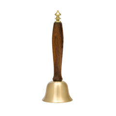 Decorative Brass bell with a wooden handle on a white background