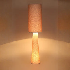 Oslo Floor Lamp switched on showing warm ambient glow with a textured brown shade