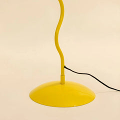 Yellow Wavy floor lamp stand with a curved design