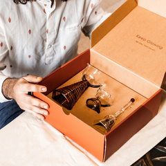 Muun Home glass gift box with Tall diya, short diya and glass ringing bell.