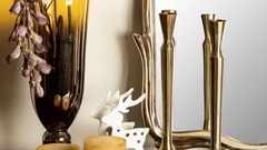 Unique style tall antique brass finish Tvisa candle holders with a textured surface.