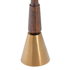 Gold brass bell with wooden top on a white background