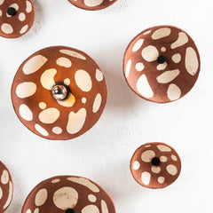 Decorative Wall Light like knobs with brown and white pattern made of clay