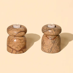 Two marble Astra Tea Light Candle Holders with candles