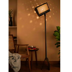 Black metal Reeding Floor Lamp switched on showing warm ambient glow
