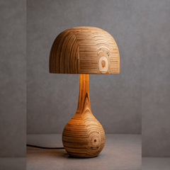 Belly table lamp with a whimsical, mushroom-like shape made from sustainable waste plywood, with warm light