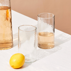 2 Hammered Glasses with textured design and Carafe filled with liquid