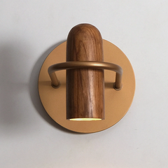 Wood shell wall lamp in natural wood finish illuminating living room