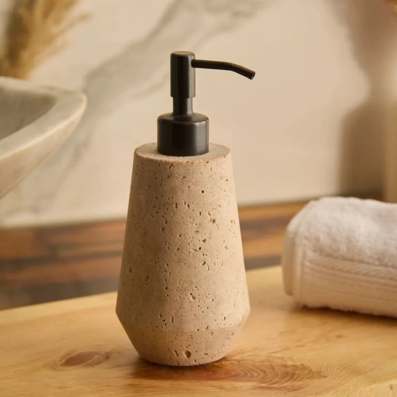Otel Travertine Soap Dispenser - On Wooden Counter Beside Towel, Faceted Travertine Body