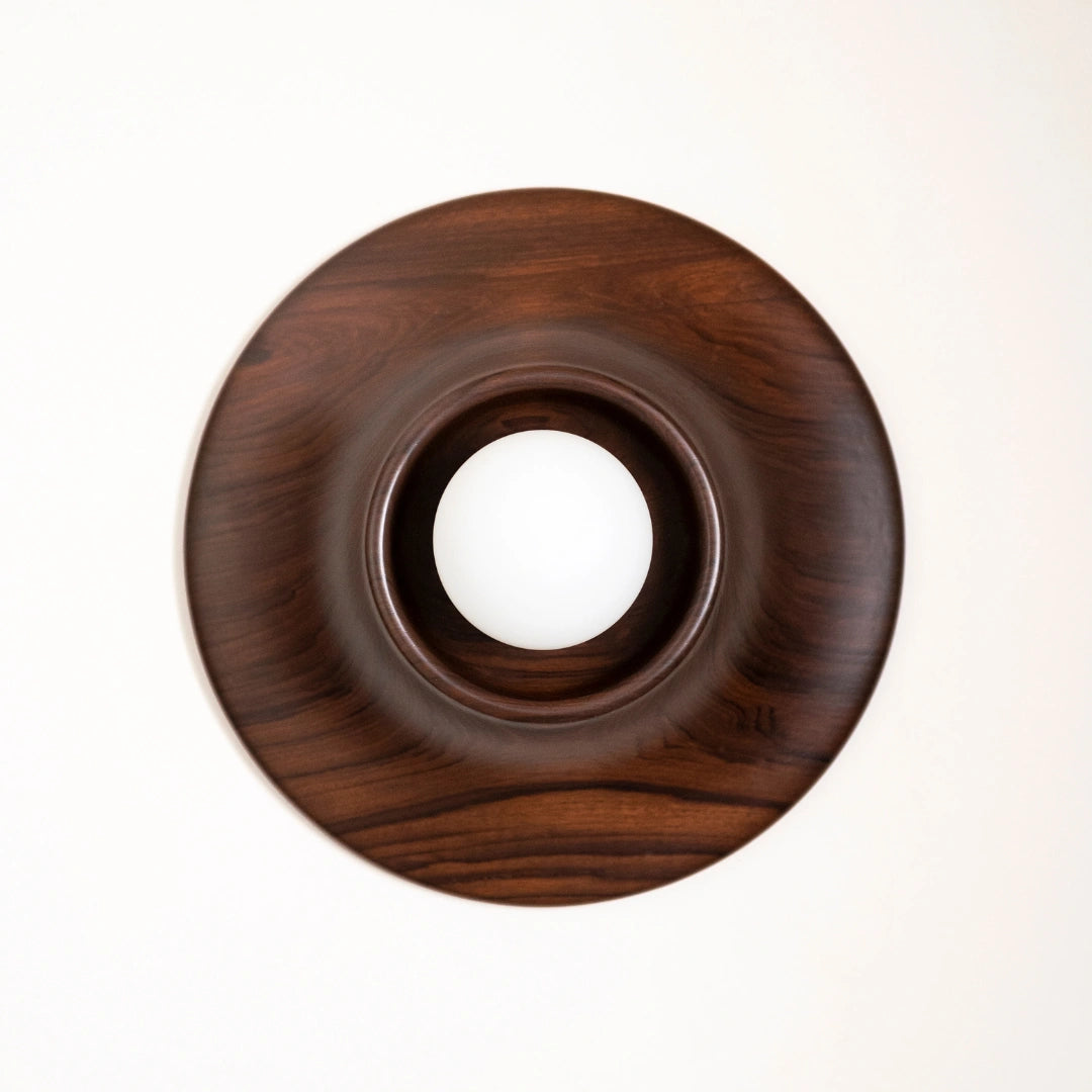 Wooden circular Paten Wall Light with a central hole on a white background