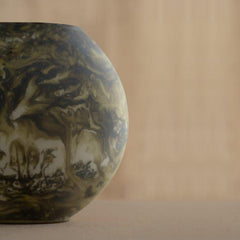 Marble-patterned Bella Green Vase on a beige background