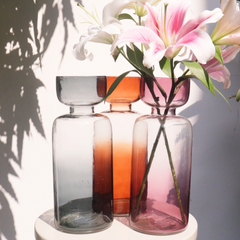 Decorative tinted glass vase with gradient of vibrant colors