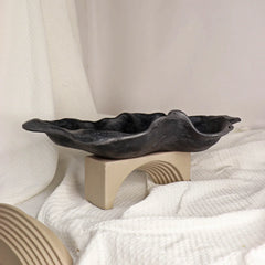Black Kai ceramic organic bowl with a swirled edge design.