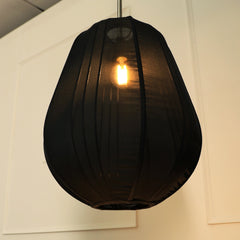 Black shade hanging light that intertwines classical elegance with modern softness