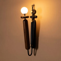Dash & Dot Wall-mounted lamp with a warm glow on a beige wall