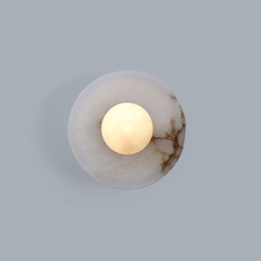Natural stone Blot wall light in aged brass finish for modern interior