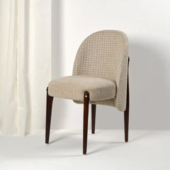Beige checkered chair with wooden legs on a white background