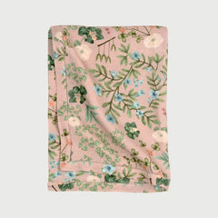 Valley Rose Linen Table Cover folded, showing Himalayan floral print and hem-stitch border