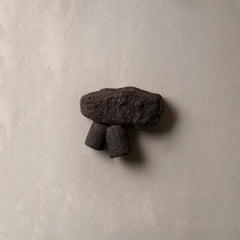 Dark stone stone structure wall light fixture.