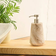 Otel Butterscotch Soap Dispenser - On Wooden Board Beside Plant, Faceted Marble with Steel Pump