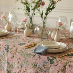 Valley Rose Linen Table Cover place setting with cream plates and embroidered napkin