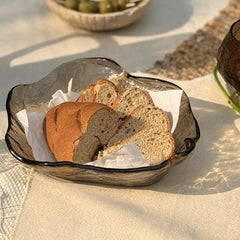 Decorative glass bowl in Dusk Brown color with bread served on it.