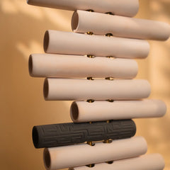 Chord 180 D Floor Lamp showing stack of cylindrical objects by Keph Design Studio
