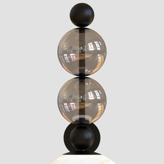 Wall sconce showing steel bracket and dual glass globes