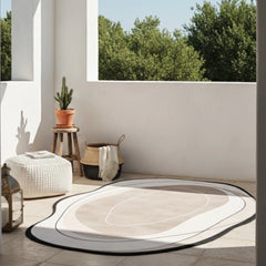 Round outdoor rug on a patio with plants and a stool in the background