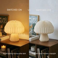 A split comparison showing a pleated mushroom-shaped table lamp in two states: switched on glowing warm yellow, and switched off in off-white. Text overlays read 'SWITCHED ON', 'SWITCHED OFF', and describe the lighting effects.