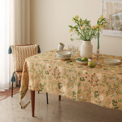 Valley Peach Linen Table Cover on dining table with chair and patterned cushion, angled view