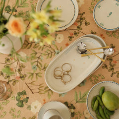 Valley Peach Linen Table Cover top view with serving platter, gold cutlery and fruit bowl