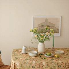 Valley Peach Linen Table Cover on dining table below framed artwork, front view