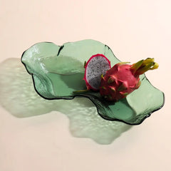 Moss Green glass serveware with a dragon fruit on a beige background