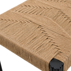 Tessa Dining Chair detail of woven jute seat texture and fluted black teakwood leg top