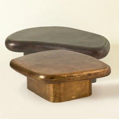 Two wooden stools for coffee with a curved design for that aesthetic look