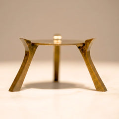 Muun Ghee Daani three-legged metal warming base, brass-antique finish, standalone view