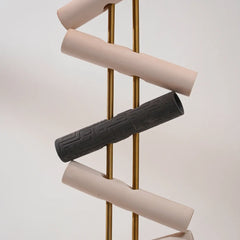 Set of bicycle handlebar grips in beige and black on a white background