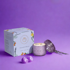 Lavender Breeze Trinket Jar Candle, lit patterned glass jar and box on a vivid purple backdrop