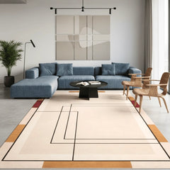 Modern living room with a blue sectional sofa, round coffee table, and abstract art on the wall.