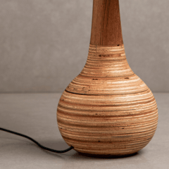 Belly Table Lamp, close view of with a textured design plywood on a neutral background