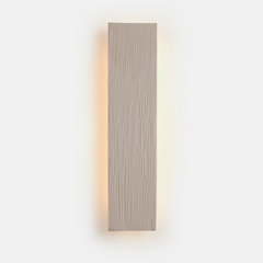A vertical beige color wall sconce wall light fixture with a white background.
