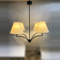 Windsor Branch Chandelier - front view of glowing cream shades on a black curved frame
