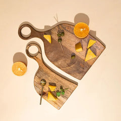 Wooden Yin-Yang Platter Set of Two with cheese, olives and orange halves, mango wood, top view