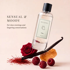 Vibe - Sensual & Moody Perfume Room Spray - Tilted Glass Bottle on Vanilla Bean with Red Rose, Saffron & Raspberries, Angled View