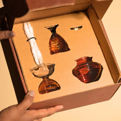Kalash Oil Lamp + Short Ringing Bell + Short Diya packed in open kraft gift box with cotton wicks, top view