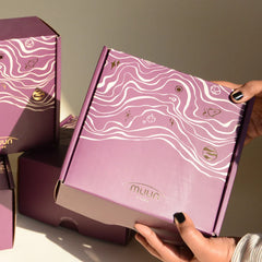 Glass Tall Diya & Ringing Bell Pink in a purple Muun home gift box held in hands, front view
