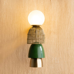 Totem Gold Wall Lamp, gold textured form casting ambient warm glow.