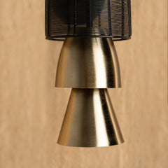 Close-up of Totem Black Wall Lamp showing hanging integrated LED lighting bar within totemic form