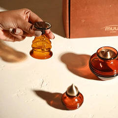 Kalash Oil Lamp + Small Ringing Bell + Mini Kalash, hand lifting small bell with lamp and mini kalash nearby